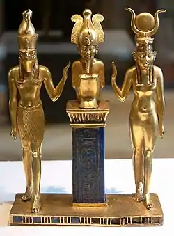 Osiris on a lapis lazuli pillar in the middle, flanked by Horus on the left, and Isis on the right, 22nd dynasty, Louvre