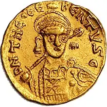 A coin depicting the highly stylised crowned head of a man