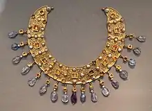 Collier; late 6th–7th century; gold, an emerald, a sapphire, amethysts and pearls; diameter: 23 cm (9.1 in); from a Constantinopolitan workshop; Antikensammlung Berlin (Berlin, Germany)