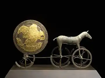 The Trundholm sun chariot, perhaps 1800–1500 BCE; this side is gilded, the other is "dark".